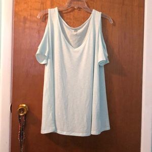 Light blue tank top with cut shoulder sleeves